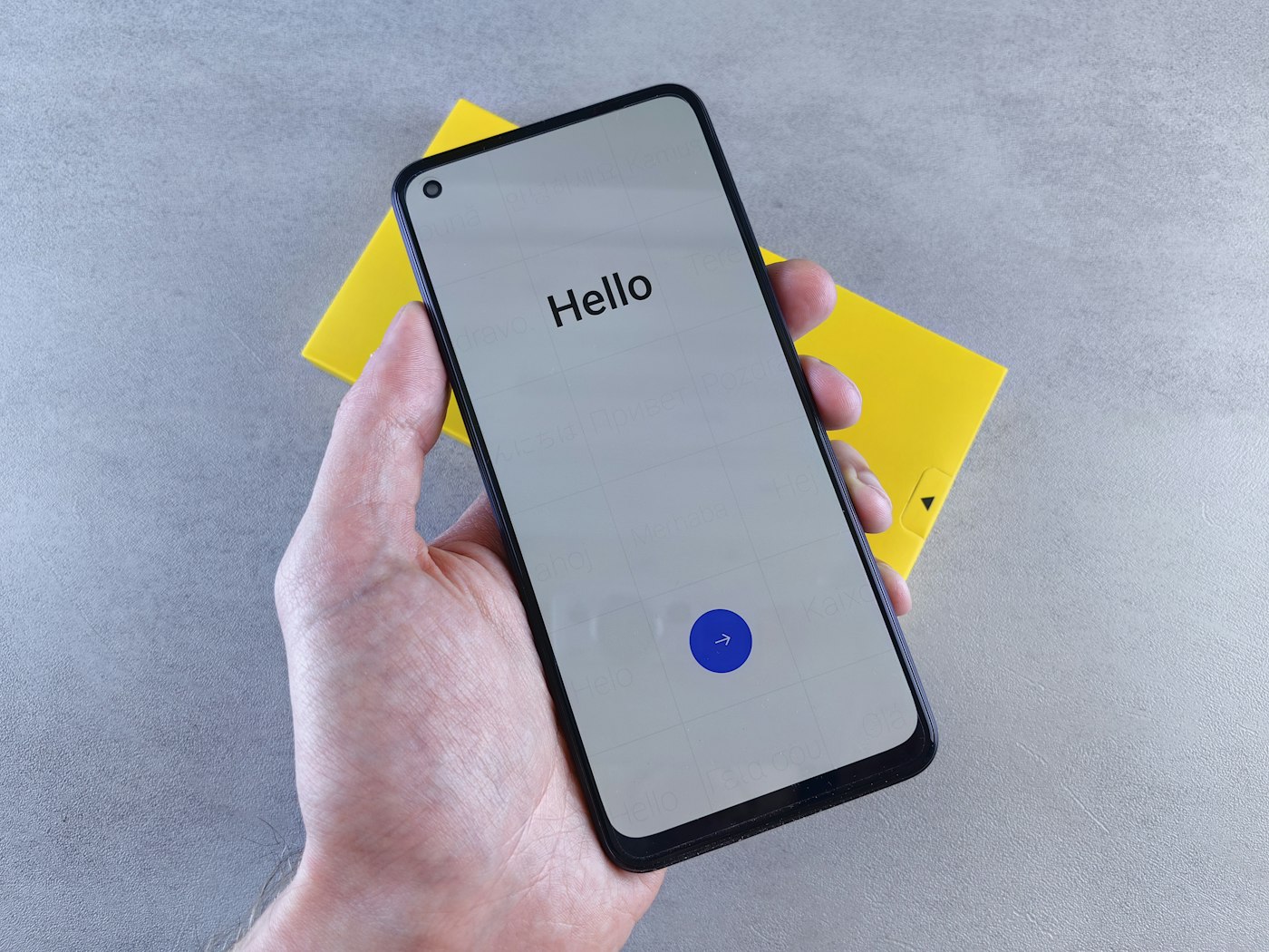 A hand holding a smartphone